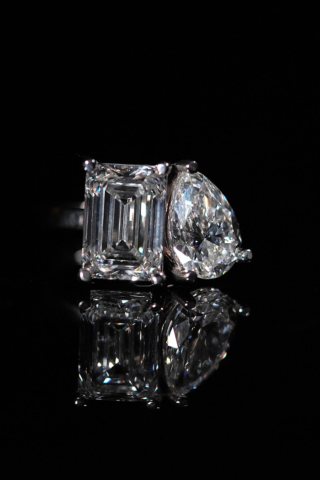 A high-end display of the best engagement rings in Fort Worth, featuring custom gold and platinum designs by Jacob Mark Jewelers.